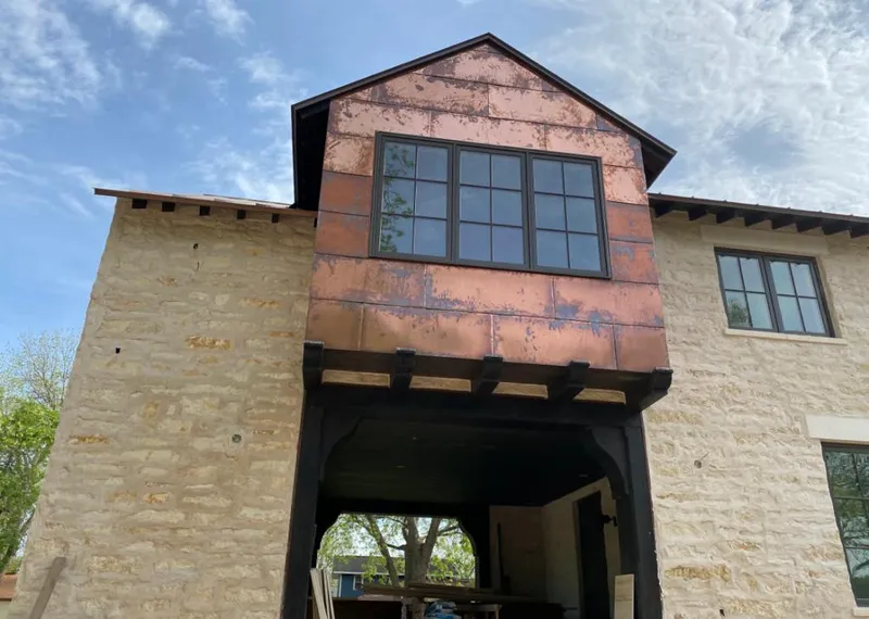 Copper metal panel facade on a stone building for Metal Roof Coating in Benicia